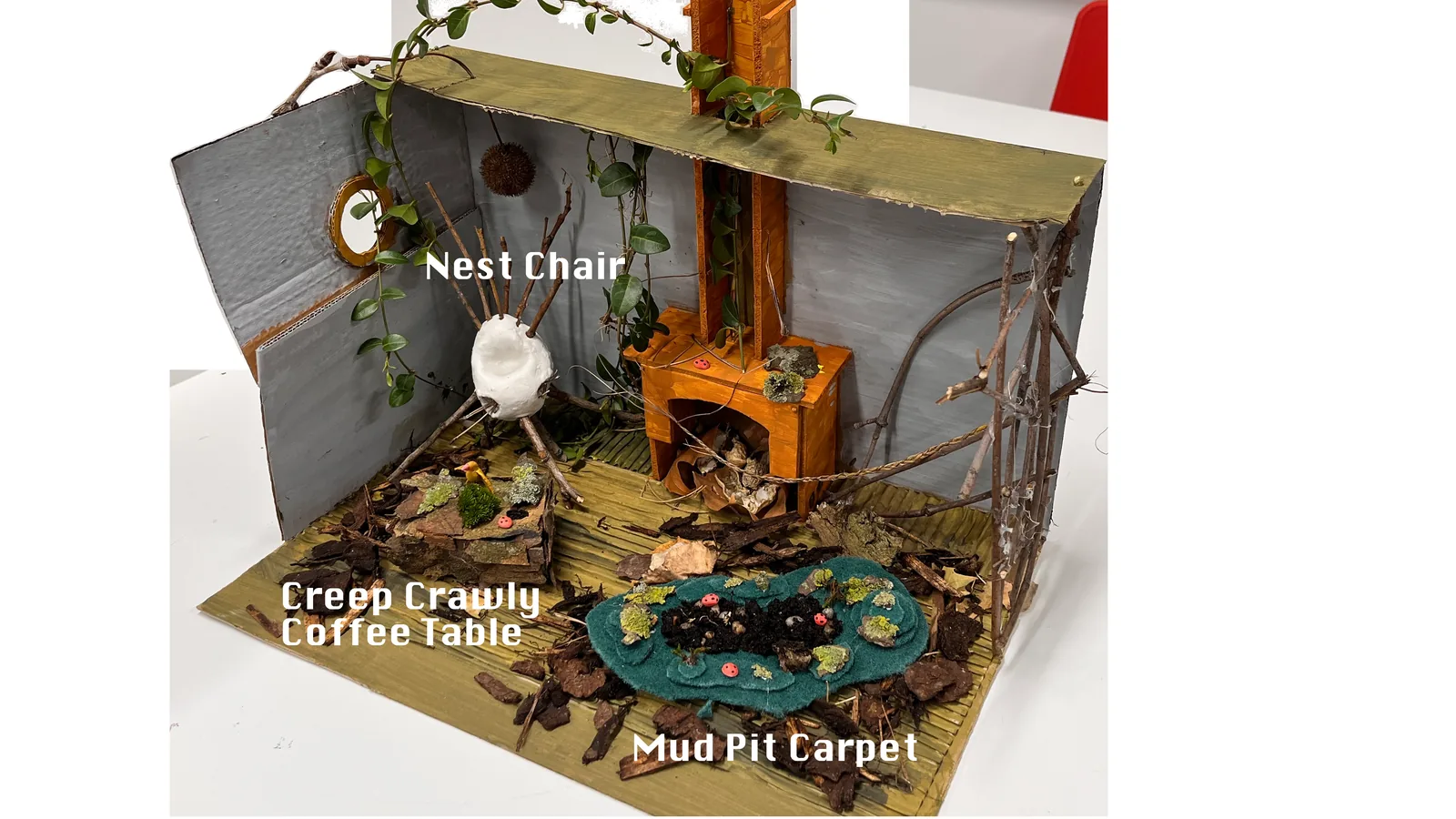 Scale prototype of the room with the Nest Chair, Creepy Crawly Coffee Table and Mud Pit Carpet.