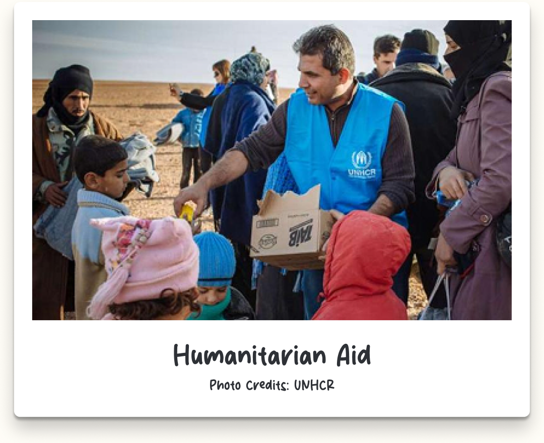 Humanitarian aid workers distributing supplies. Photo credits: UNHCR.